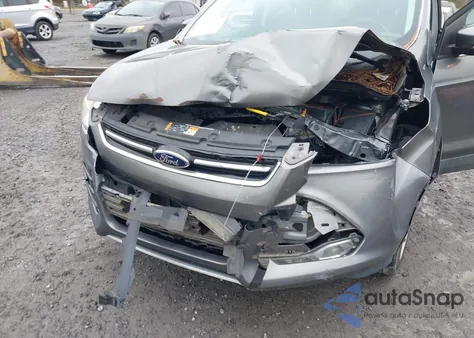 2014 Ford Escape Titanium z USA, uszkodzony, nr VIN 1FMCU0J94EUD63458